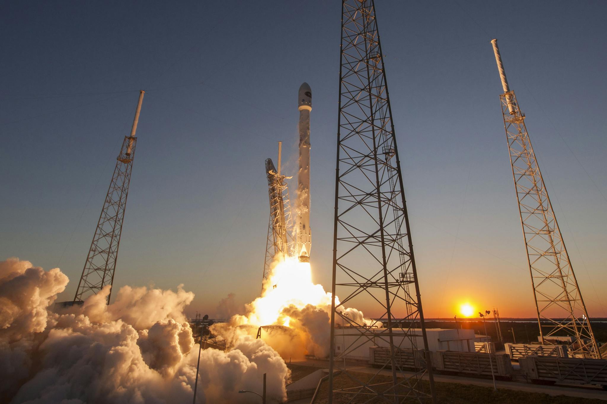 Spacecraft launching into orbit during sundown